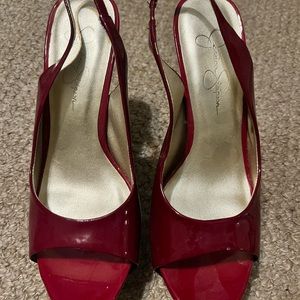 Jessica Simpson red pantent leather high heel,Peep toe with heel strap. Size 7.
